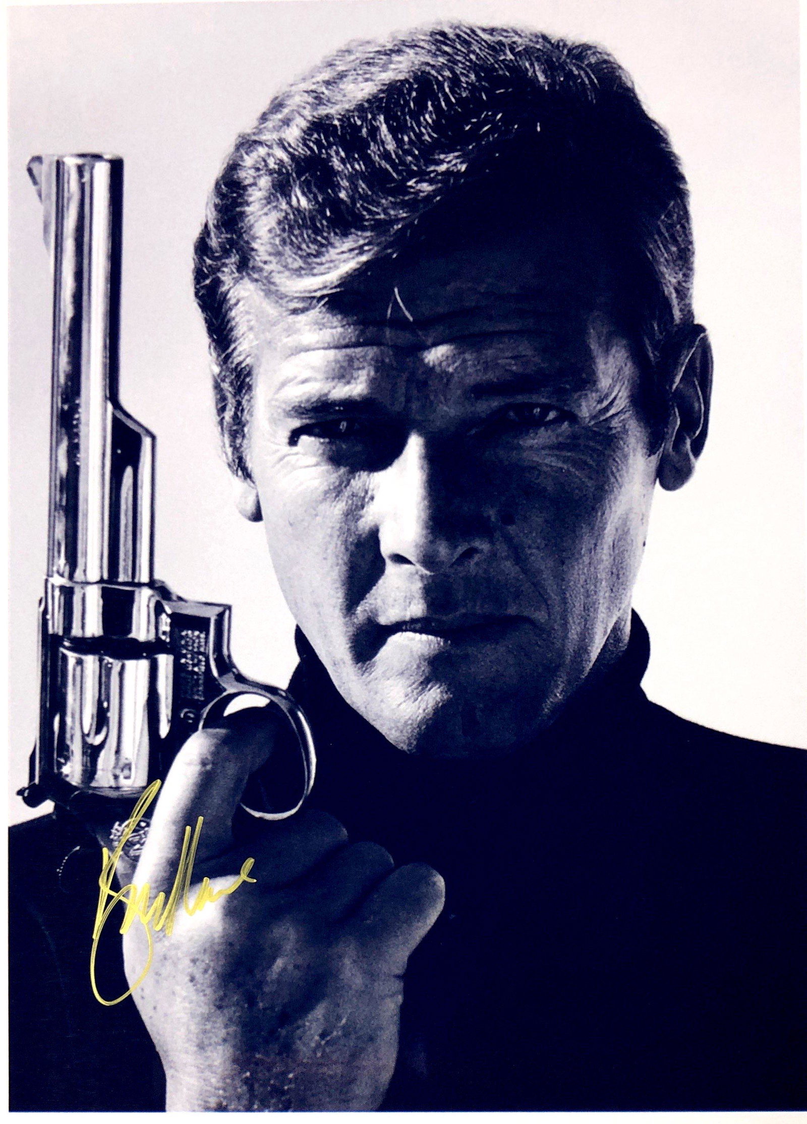 Roger Moore Autograph Signed James Bond 007 Photo: Category: Autograph Photo CollectiblesSize: Width 8 inches x Height 10 inchesAutograph Includes: Roger MooreItem is in great condition with no damage, unframedIf image of documentation is not attached