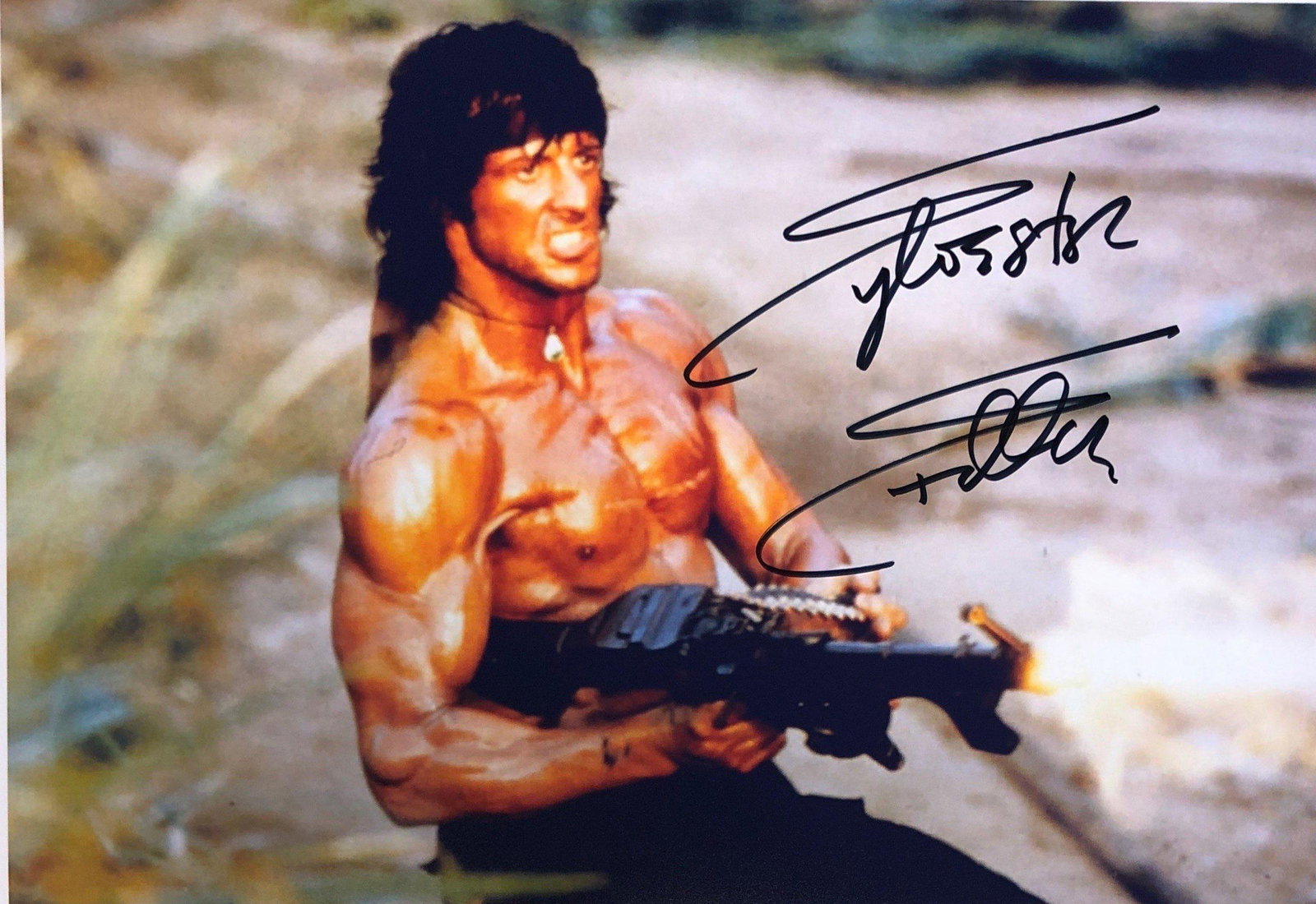 Sylvester Stallone Autograph Signed Rambo Photo: Category: Autograph Photo CollectiblesSize: Width 8 inches x Height 10 inchesAutograph Includes: Sylvester StalloneItem is in great condition with no damage, unframedIf image of documentation is not a