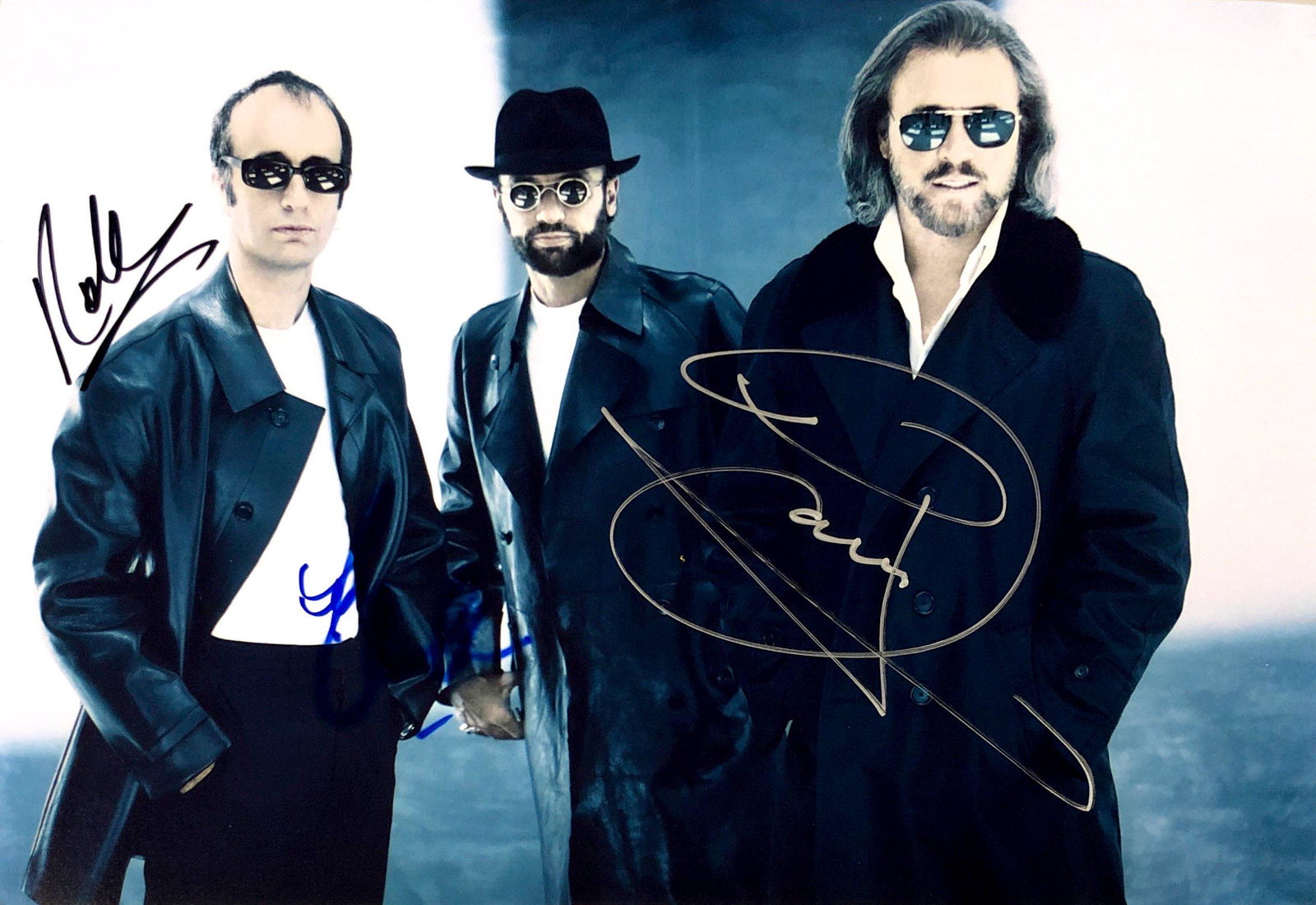 Barry Gibb Autograph Signed Bee Gees Photo: Category: Autograph Photo CollectiblesSize: Width 8 inches x Height 10 inchesAutograph Includes: Barry Gibb, Robin Gibb, Maurice GibbItem is in great condition with no damage, unframedIf image of docu