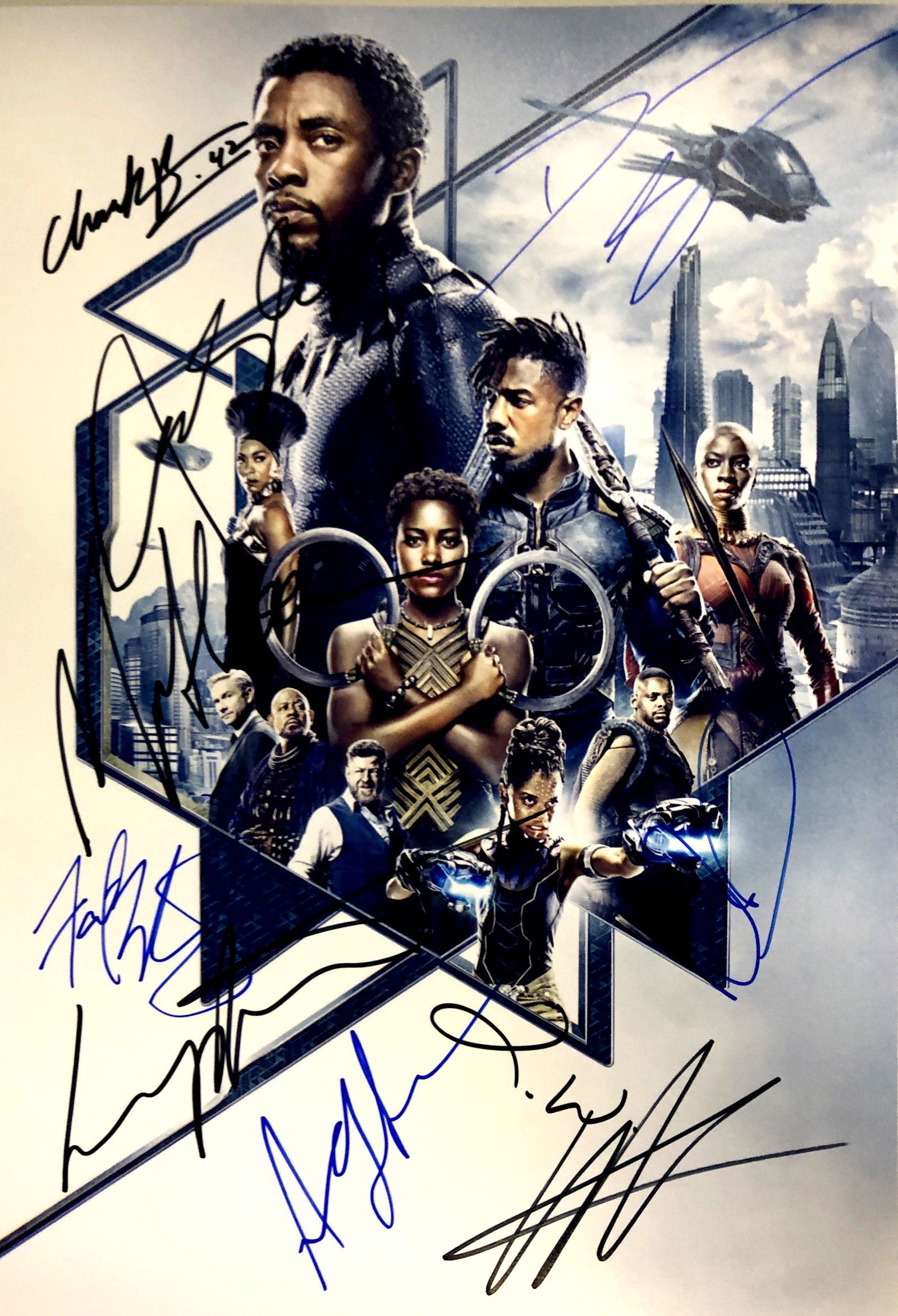Chadwick Boseman Autograph Signed Black Panther Photo: Category: Autograph CollectiblesSize: Width 8 inches x Height 10 inchesAutograph Includes: Chadwick Boseman, Michael B. Jordan, Lupita Nyong'o, Danai Gurira, Martin Freeman, Letitia Wright, Angela Bas