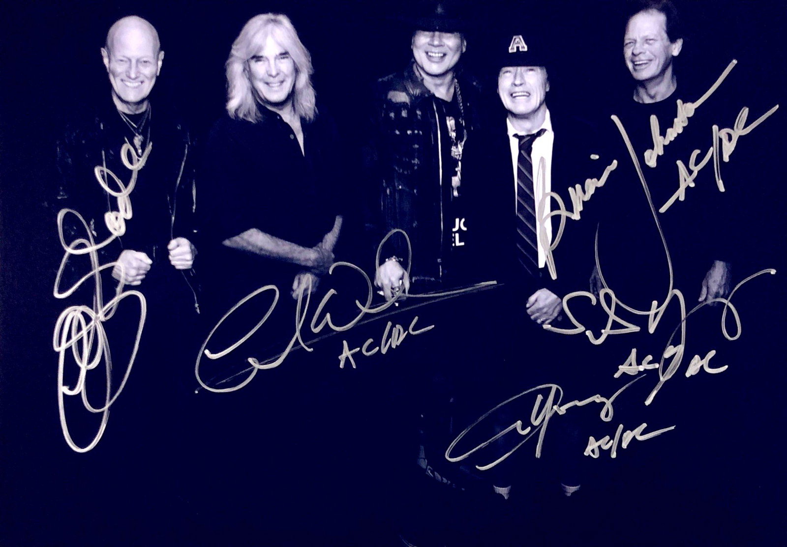 ACDC Autograph Signed Photo: Category: Autograph Photo CollectiblesSize: Width 8 inches x Height 11 inchesAutograph Includes: Angus Young, Chris Slade, Stevie Young, Cliff Williams, Brian JohnsonItem is in great condition with no