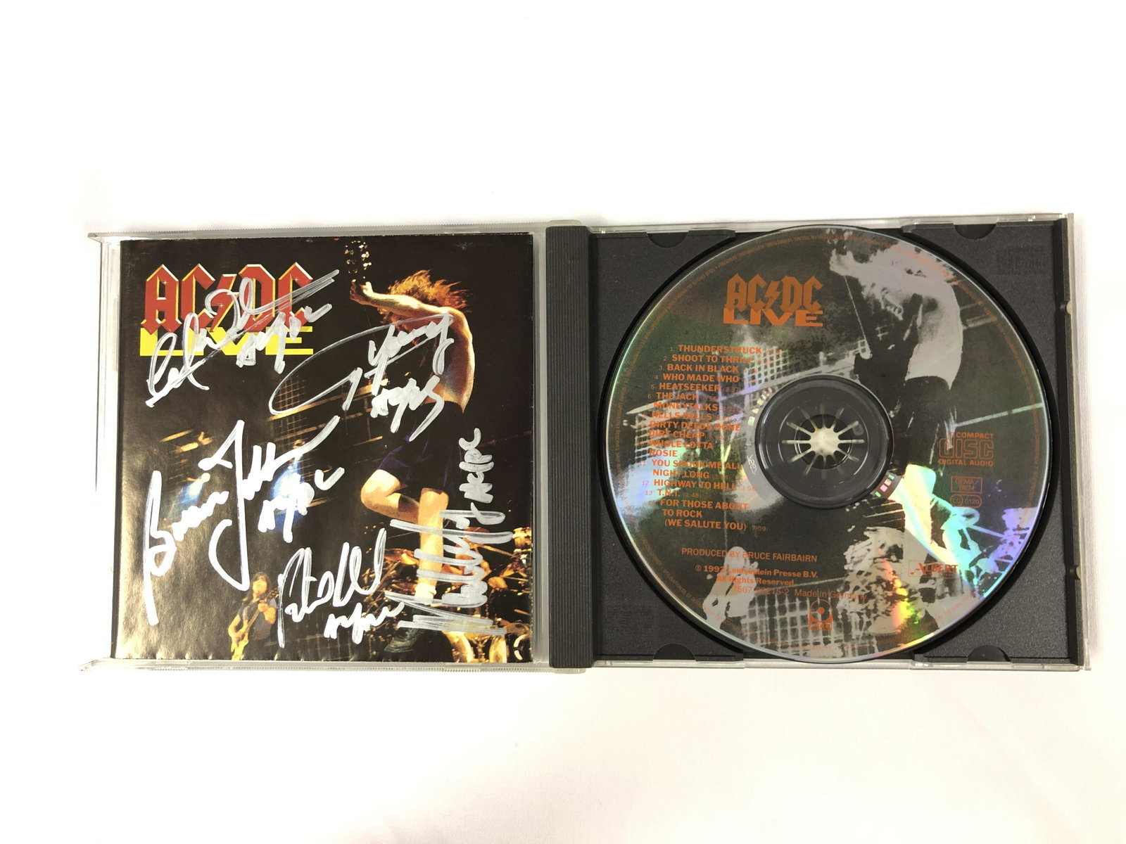 Angus Young Autograph Signed ACDC Album: Category: Autograph CollectiblesAutograph Includes: Cliff Williams, Angus Young, Brian Johnson, Malcolm Young, Phil RuddItem is in great condition with no damage, unframedIf image of documentation is 