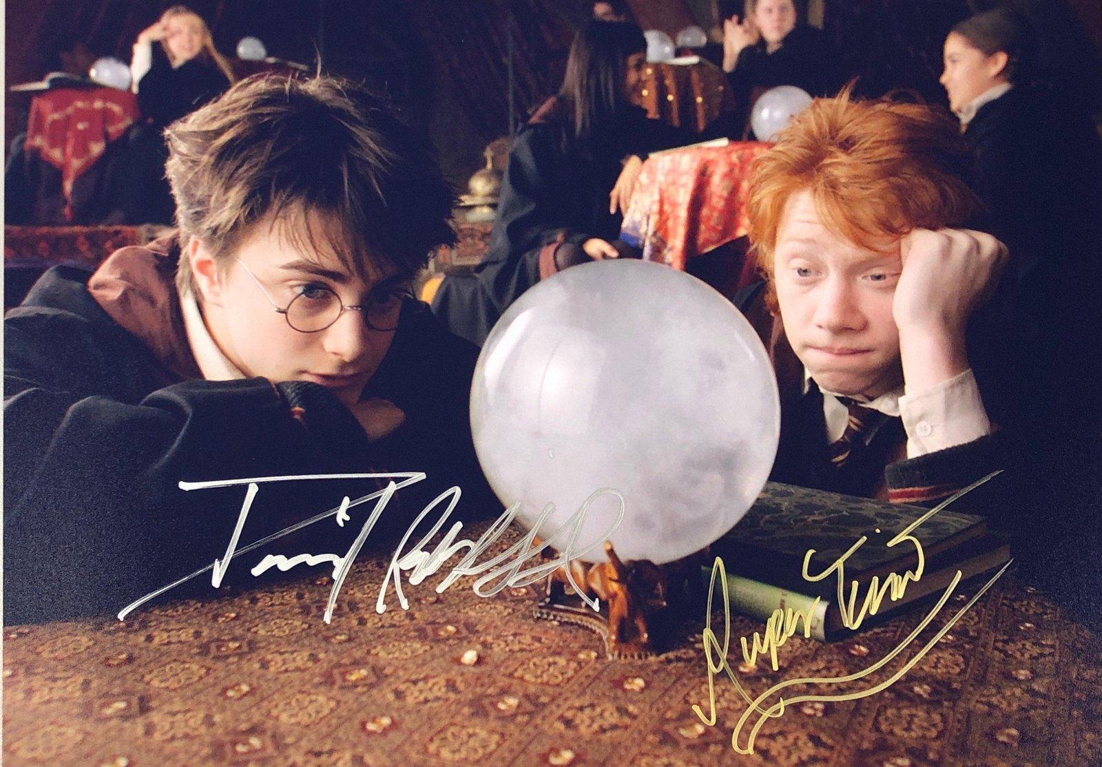 Harry Potter Signed Photo: Autographed by:Rupert Grint, Daniel RadcliffeSize: 8" x 10"Authentication Code: PC25797Item is in great condition with no damage, unframed If image of documentation is not attached in the listing, the