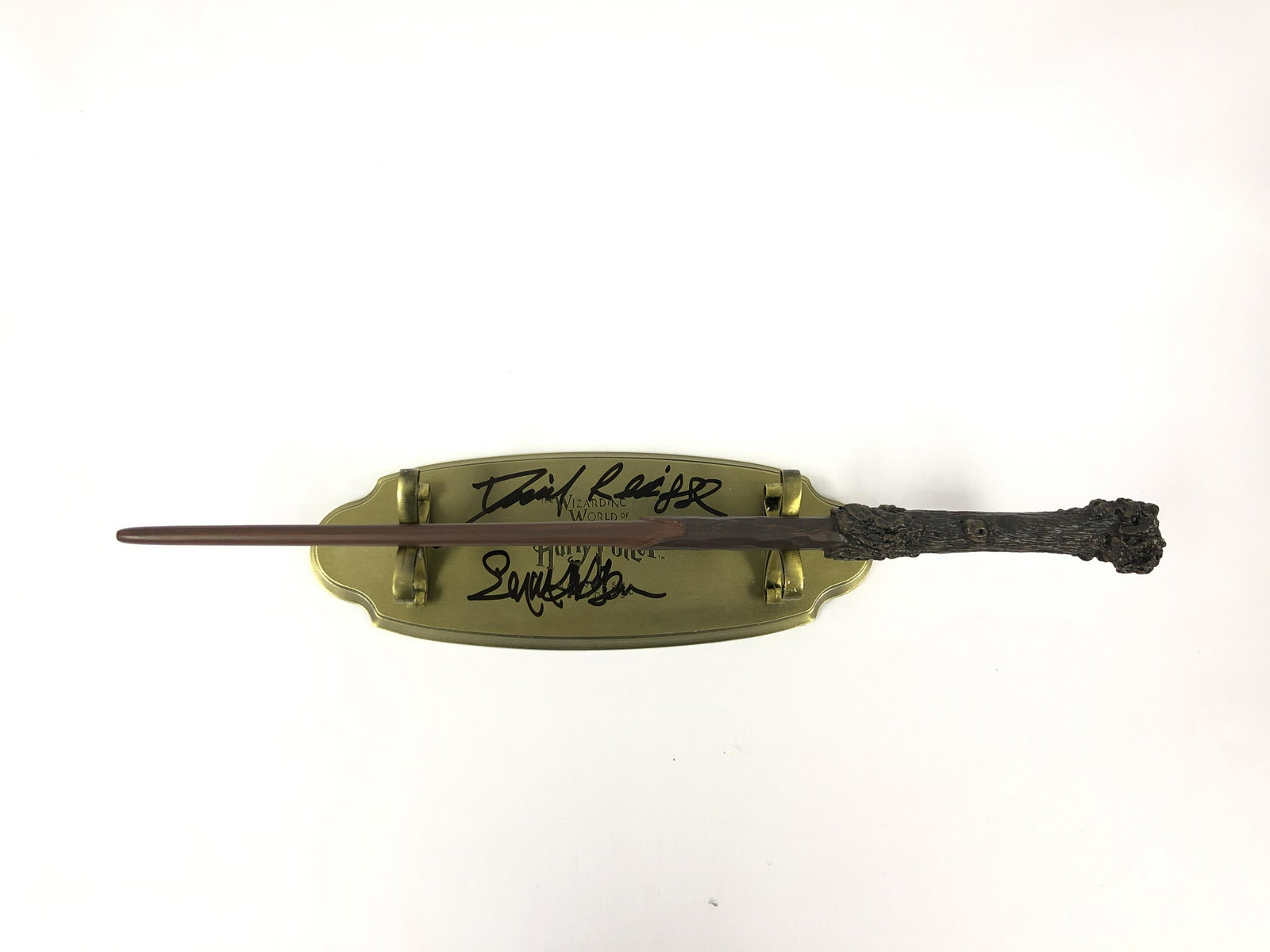 Harry Potter Daniel Radcliffe Signd Wand Stand: Autographed by:Daniel Radcliffe, Emma WatsonAuthentication Code: MP32719Item is in great condition with no damage, unframed If image of documentation is not attached in the listing, the lot is sold wi