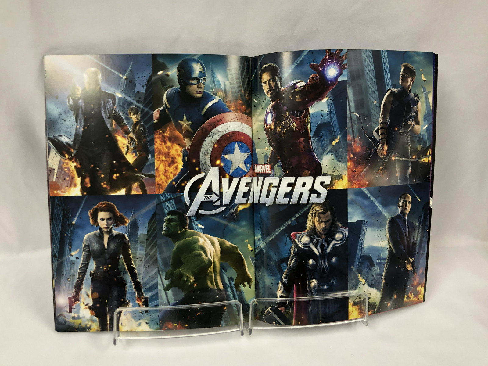 Avengers Signed Picture Book: Autographed by:Robert Downey Jr, Chris Evans, Chris Hemsworth, Scarlett Johannson, Mark Ruffalo, Samuel L Jackson, Jeremy Renner, Stan LeeAuthentication Code: MP32627Item is in great condition with no