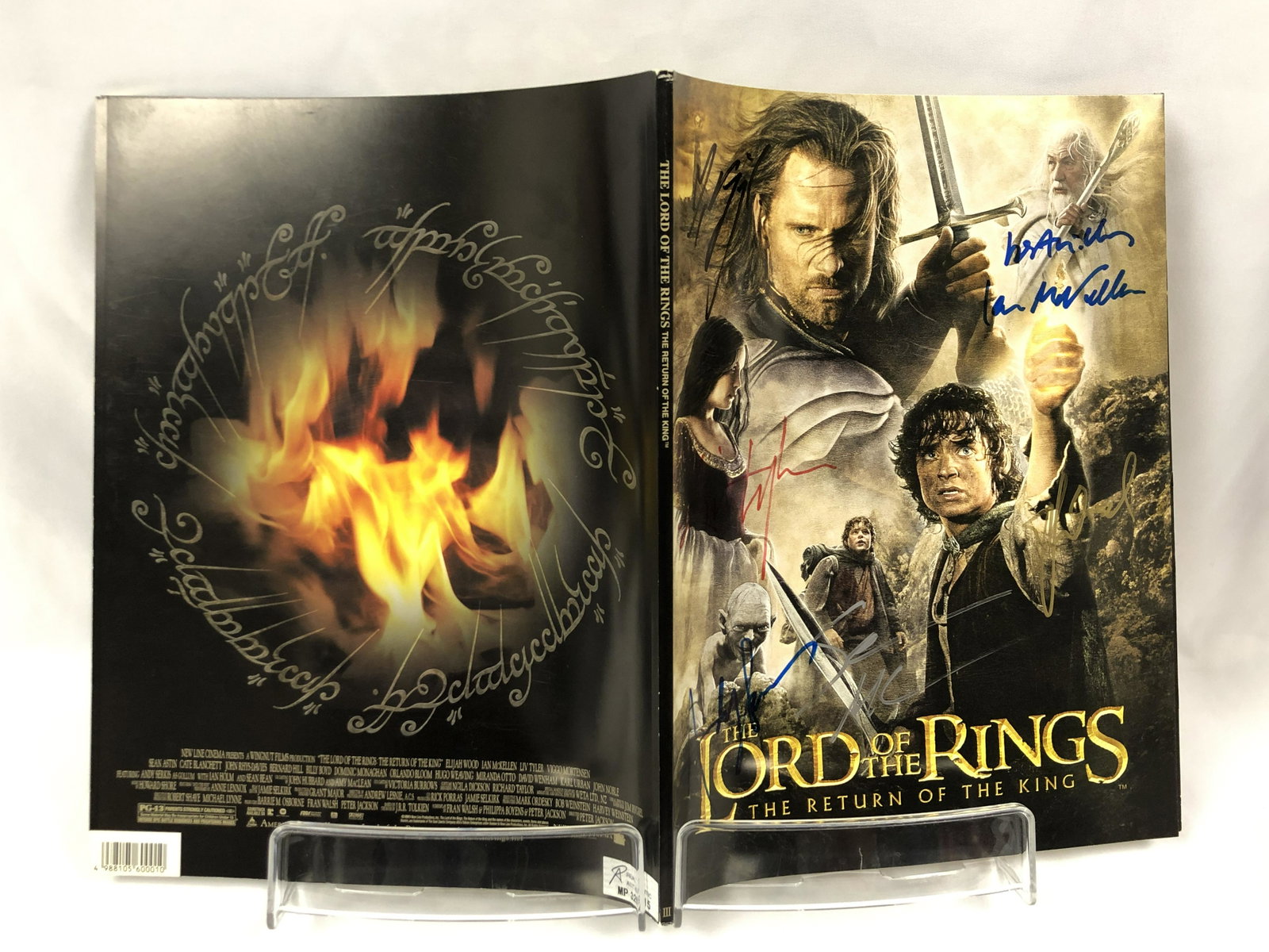 Return of the King Signed Picture Book: Autographed by:Elijah Wood, Viggo Mortensen, Liv Tyler, Ian McKellen, Sean Astin, Andy SerkisAuthentication Code: MP32615Item is in great condition with no damage, unframed If image of documentation i