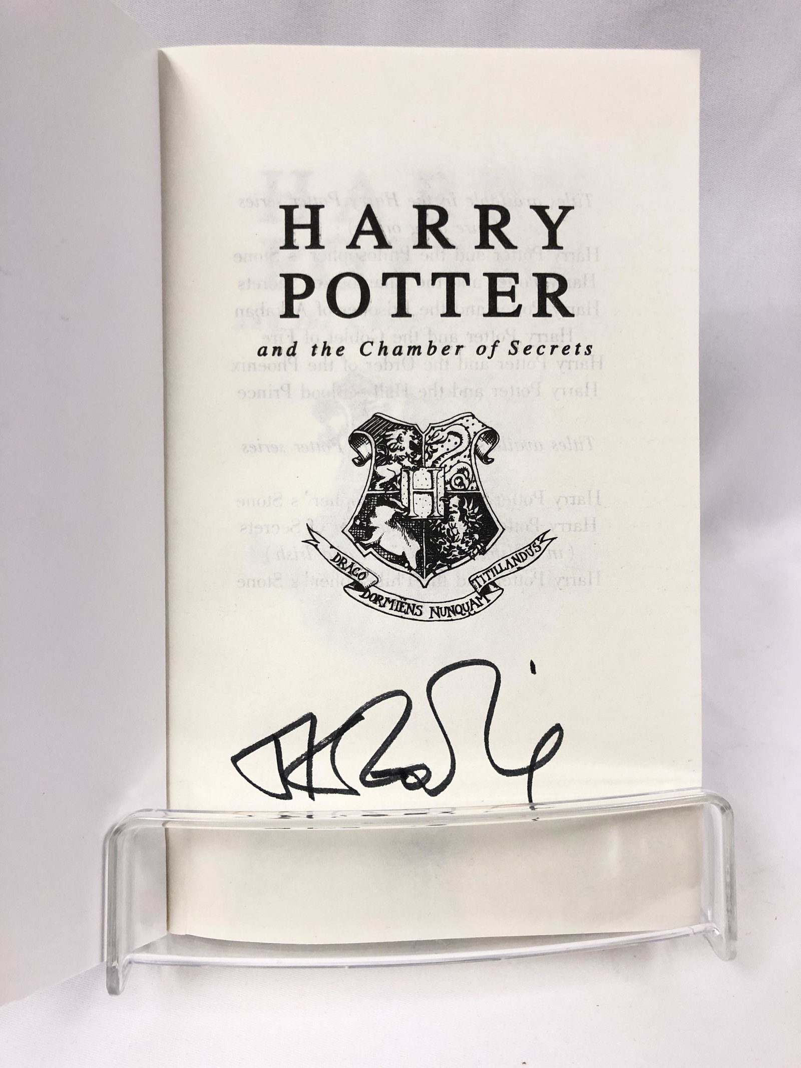 Harry Potter Daniel JK Signed Chamber of Secret Book: Autographed by:JK Rowling, Daniel Radcliffe, Emma Watson, Rupert GrintAuthentication Code: MP32835Item is in great condition with no damage, unframed If image of documentation is not attached in the l