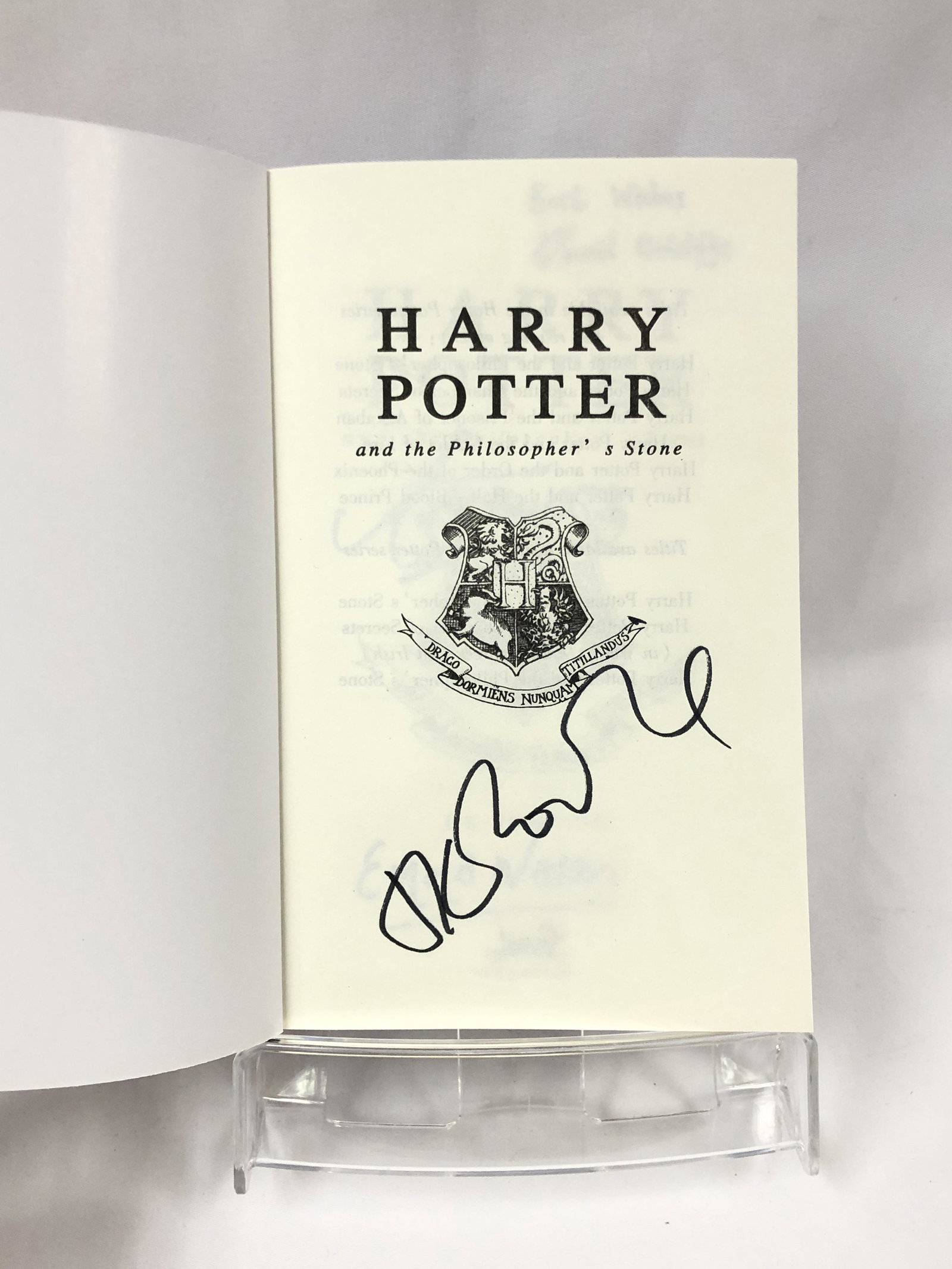 Harry Potter JK Signed Philosopher Stone Book: Autographed by:JK Rowling, Daniel Radcliffe, Emma Watson, Rupert Grint (child period autograph)Authentication Code: MP32831Item is in great condition with no damage, unframed If image of documentation