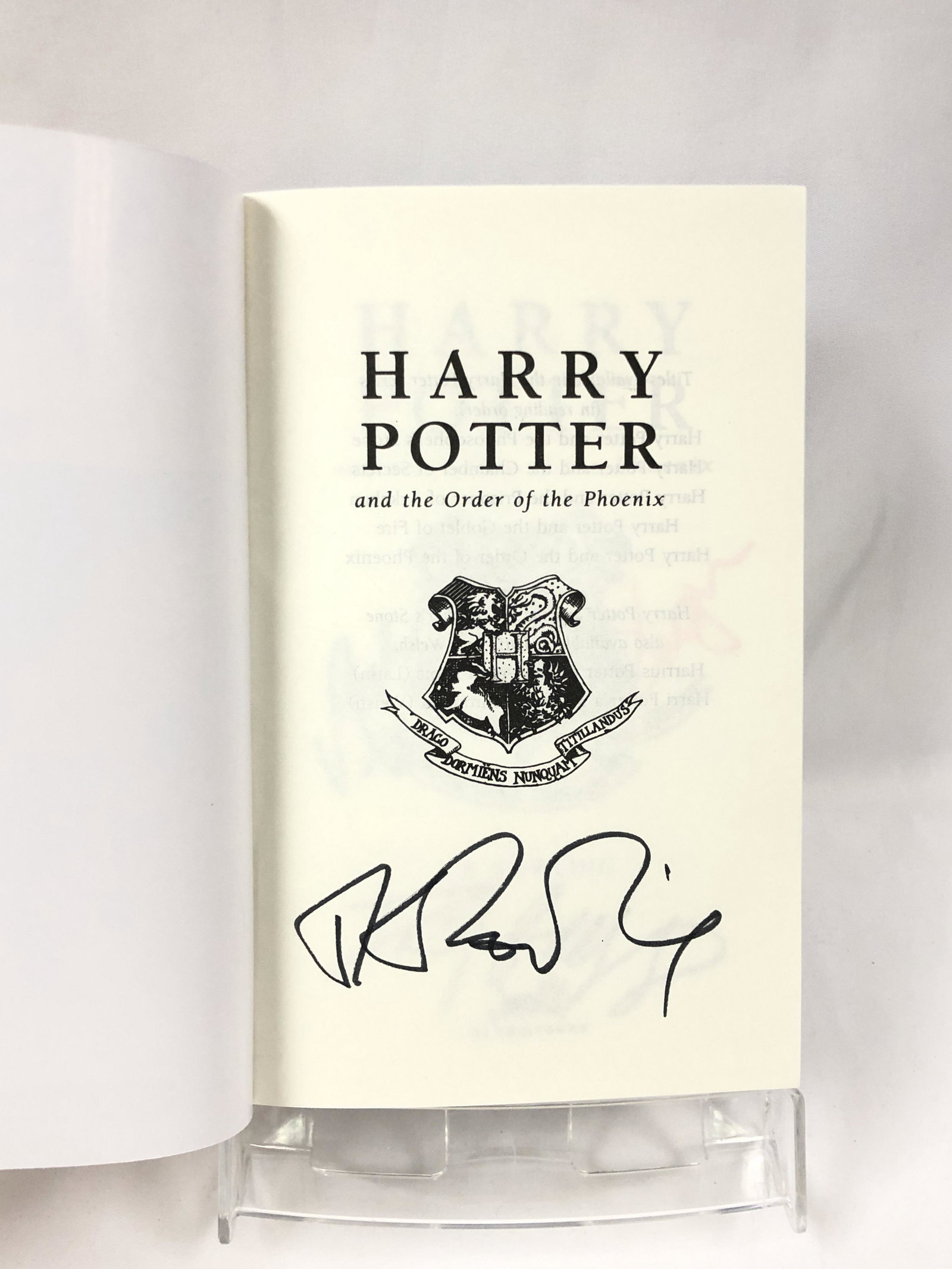 Harry Potter JK Signed Order of Phoenix Book: Autographed by:JK Rowling, Daniel Radcliffe, Emma Watson, Rupert Grint Authentication Code: MP32830Item is in great condition with no damage, unframed If image of documentation is not attached in the 