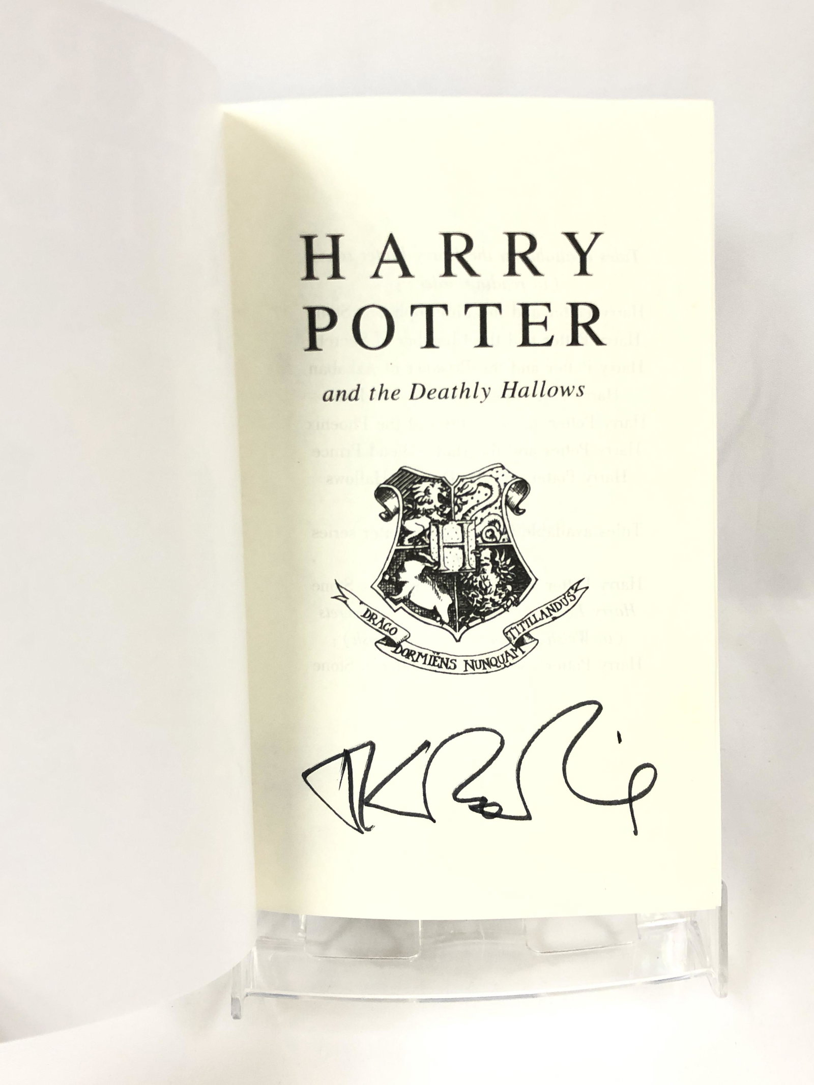 Harry Potter JK Signed Deathly Hallows Book: Autographed by:JK Rowling, Daniel Radcliffe, Emma Watson, Rupert Grint Authentication Code: MP32829Item is in great condition with no damage, unframed If image of documentation is not attached in the 
