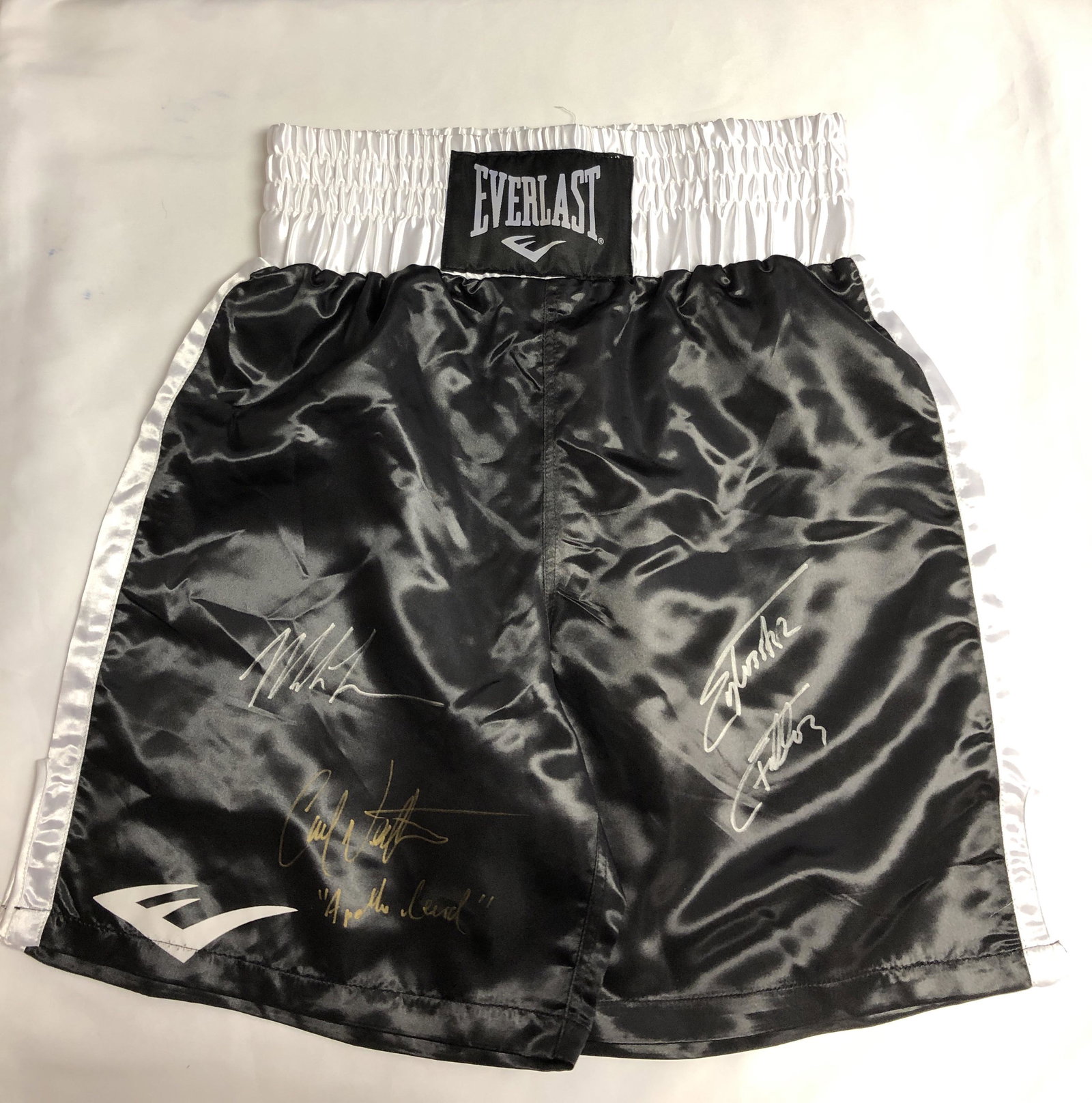 Rocky Sylvester Stallone Signed Boxing Shorts: Autographed by:Sylvester Stallone, Mike Tyson, Carl WeathersAuthentication Code: MP32817Item is in great condition with no damage, unframed If image of documentation is not attached in the listing, th