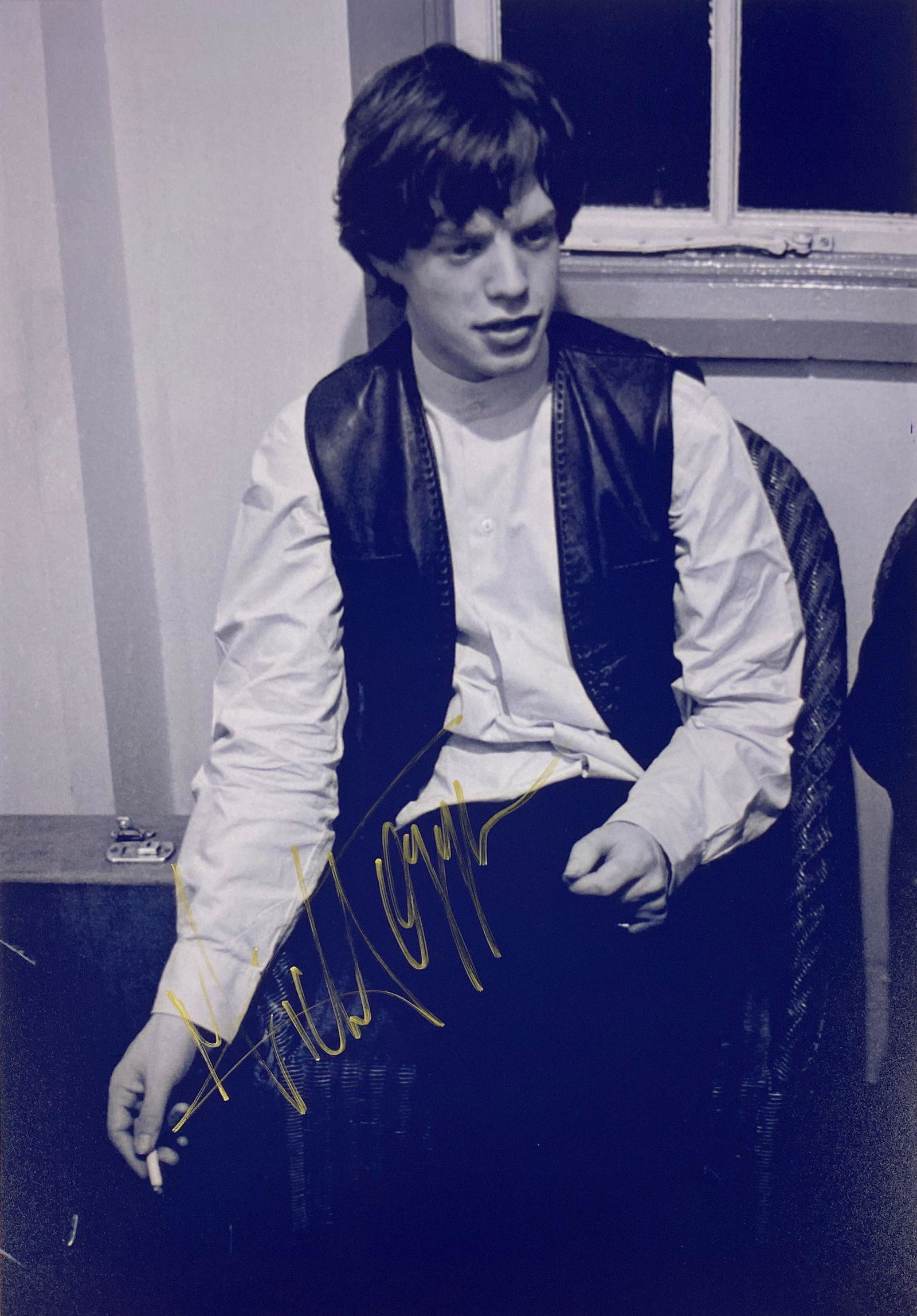 Rolling Stone Mick Jagger Signed Photo: Autographed by:Mick JaggerSize : 8" x 10"Authentication Code: PC26564Item is in great condition with no damage, unframed If image of documentation is not attached in the listing, the lot is sold witho