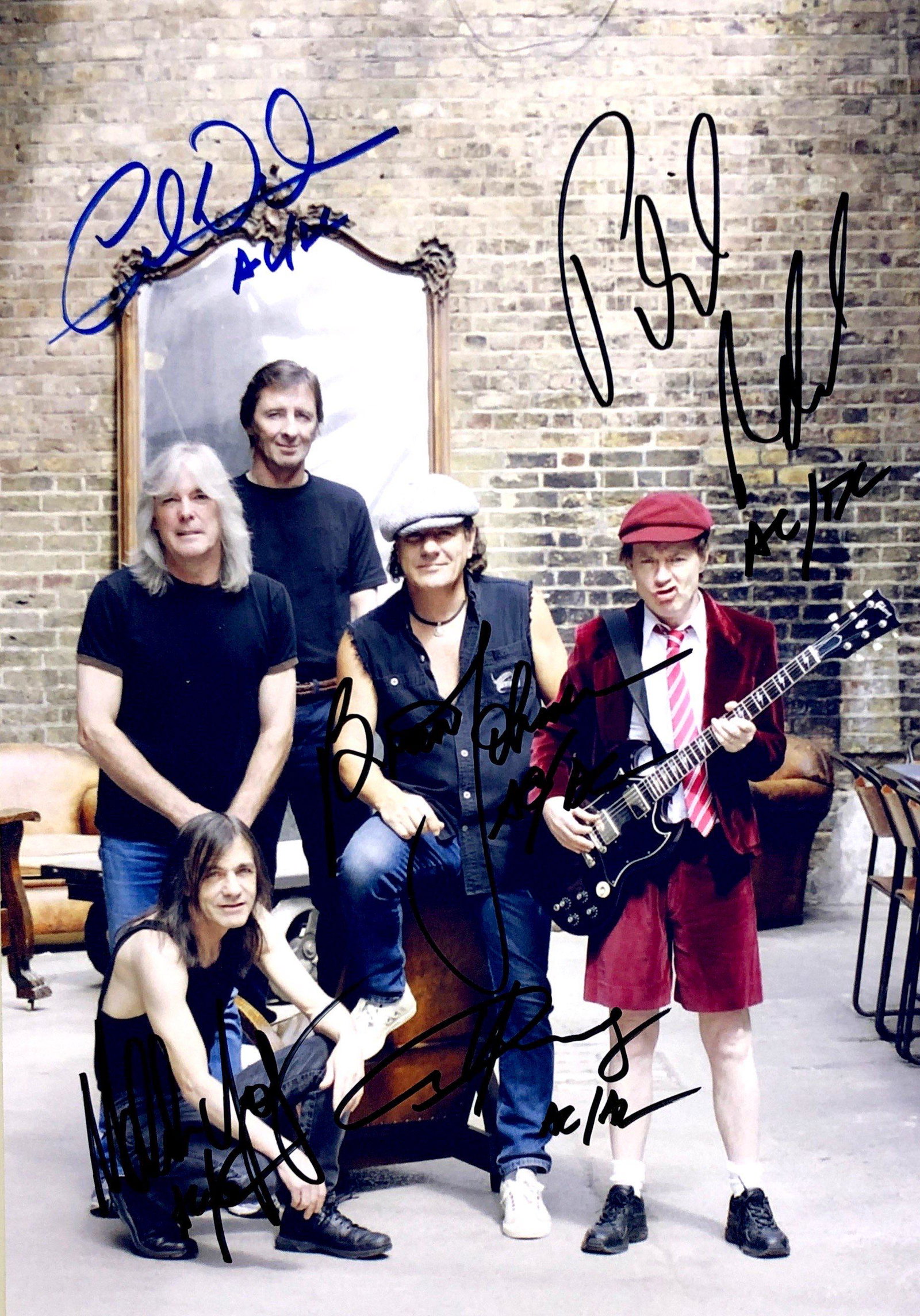 ACDC Autograph Signed Photo: Category: Autograph Photo CollectiblesSize: Width 8 inches x Height 11 inchesAutograph Includes: Angus Young, Cliff Williams, Brian Johnson, Malcolm Young, Phil RuddItem is in great condition with no 