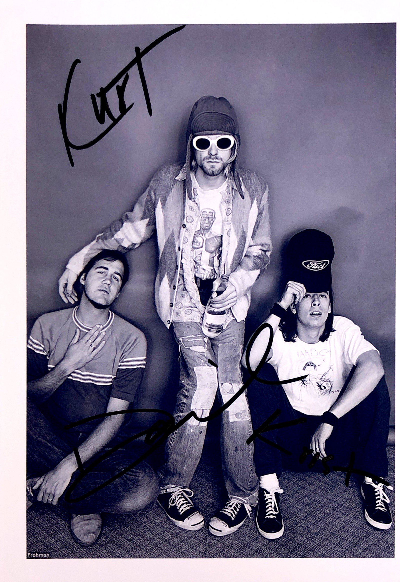Nirvana Autograph Signed Photo: Category: Autograph Photo CollectiblesSize: Width 8 inches x Height 5 inchesAutograph Includes: Kurt Cobain, Dave Grohl, Krist NovoselicItem is in great condition with no damage, unframedIf image of d