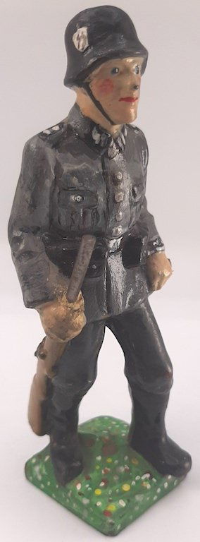 WAFFEN SS CERAMIC SOLDIER STATUE FIRE ARM HELMET TABS: A NICE LARGE CERAMIC STATUE OF A WAFFEN SS SOLDIER WEARING A SS HELMET AND A SS UNIFORM INCLUDING COLLAR TABS, CUFF TITLE AND SLEEVE EAGLE.HE ALSO HOLD A GUN.SEE LAST PICS FOR SIZE