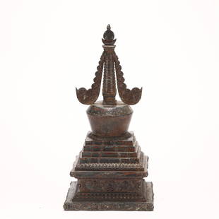 A CHINESE BRONZE BUDDHIST TOWER: L. 24 cm. H. 48 cm. Weight 12720 gram.