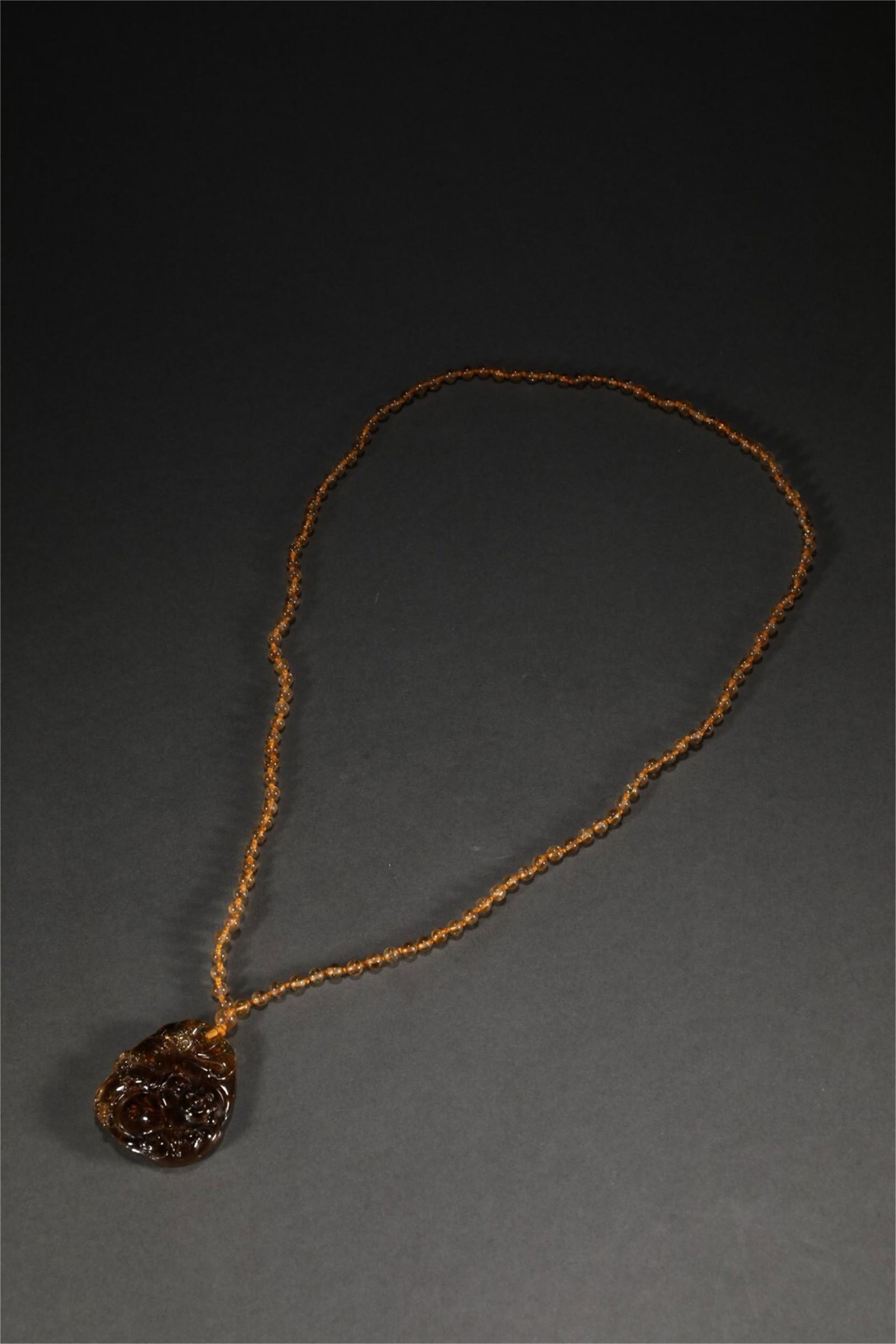 A CHINESE TOURMALINE BUDDHA PENDANT (1 of 9)