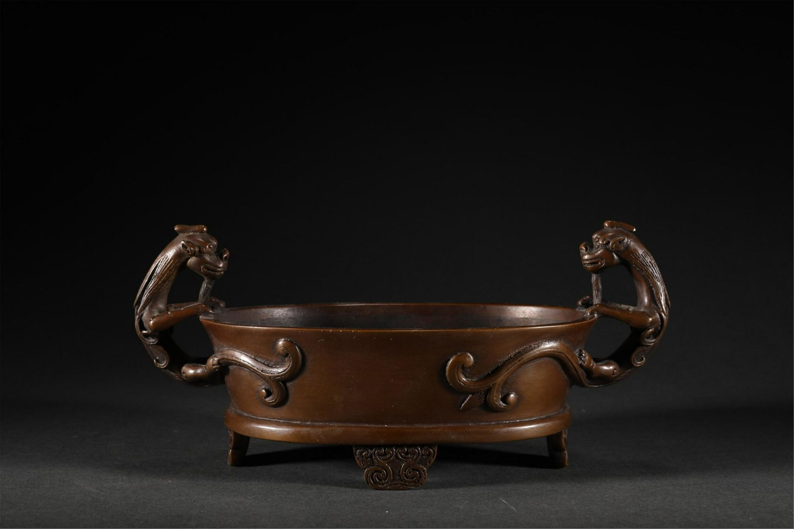 A CHINESE BRONZE DOUBLE DRAGON HANDLE CENSER (1 of 9)