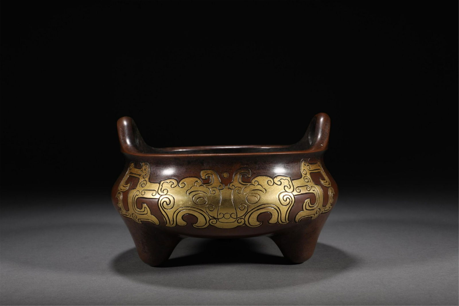 A CHINESE GILDING TRIPOD CENSER (1 of 9)