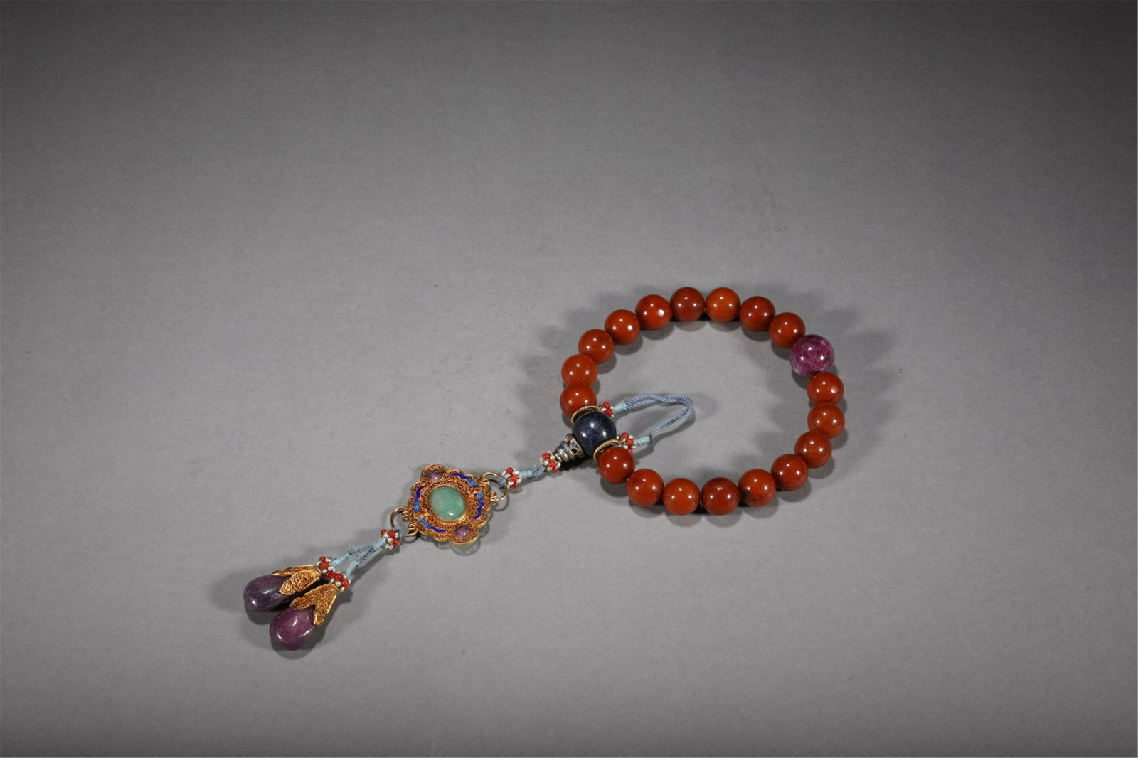 A CHINESE AMBER EIGHTEEN PRAYERS BEADS (1 of 9)