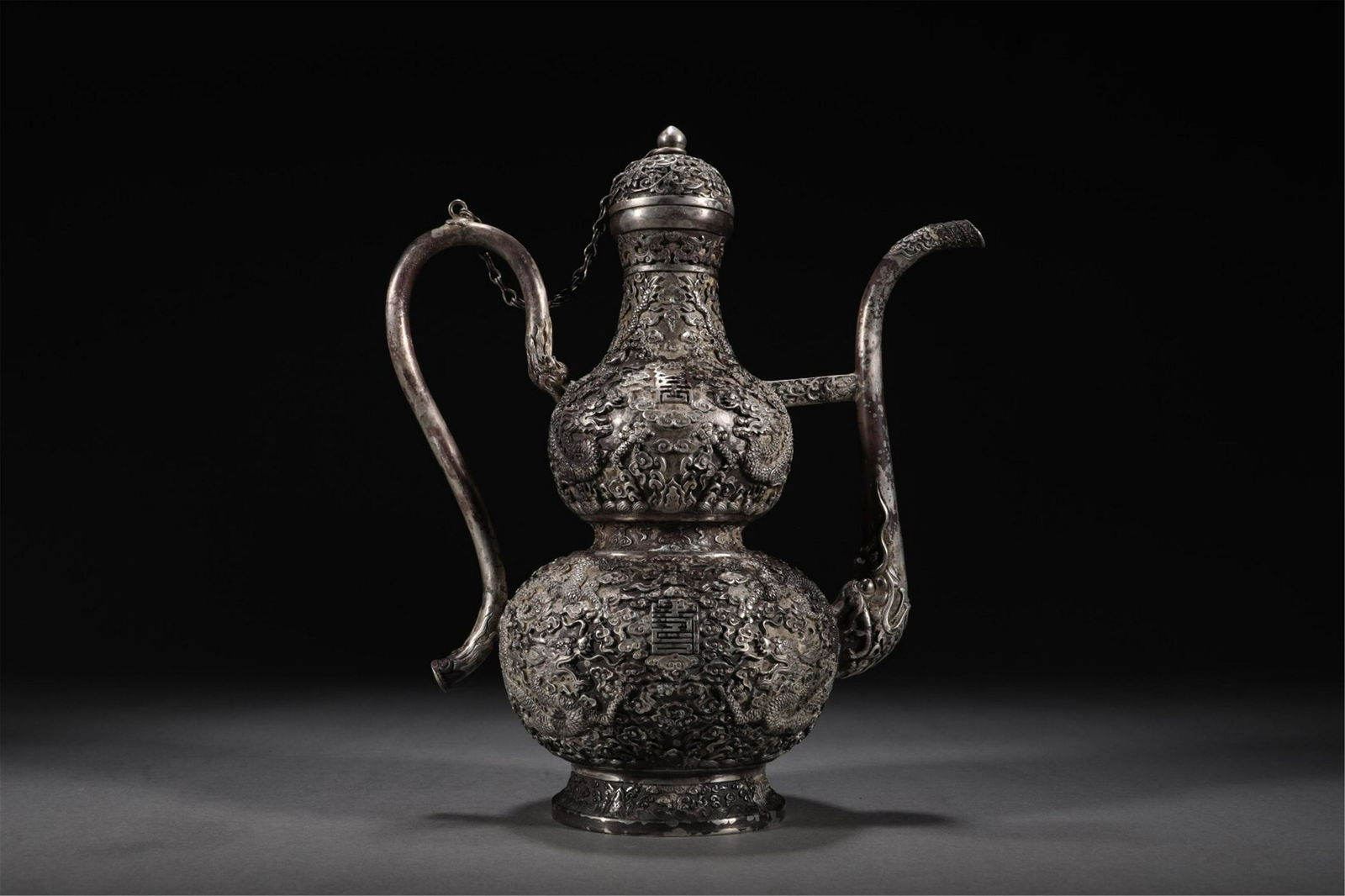 A CHINESE SILVER DRAGON PATTERN WINEPOT (1 of 9)