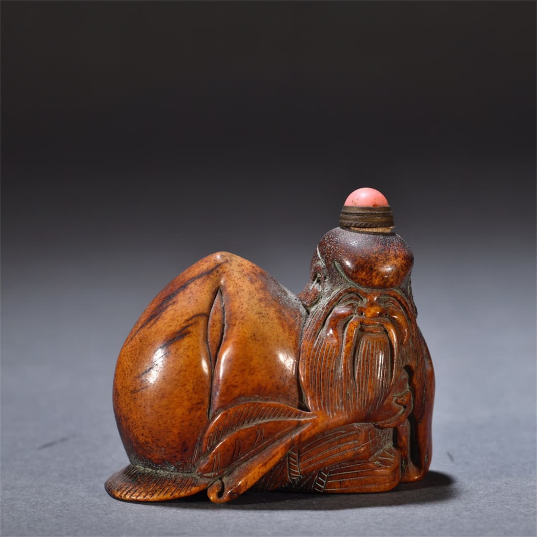 A Chinese Carved Bone Snuff Bottle: Ht. 5.8cm, Wd. 6.6cm, Wt. 84g