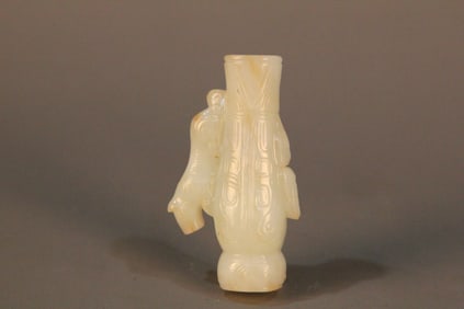 A Chinese Carved Jade Foo-Dog Pendant