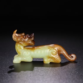 A Chinese Carved Jade Foo-Dog Statuette