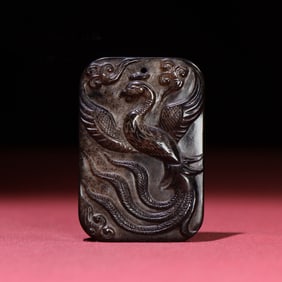 A Chinese Carved Jade Dragon and Phenix Pendant