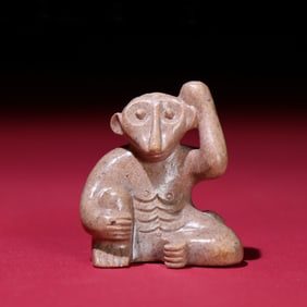 A Chinese Carved Jade Monkey Pendant