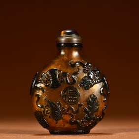 A Chinese Carved Peking Glass Snuff Bottle