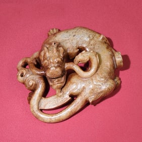 A Chinese Carved Jade Dragon Statuette