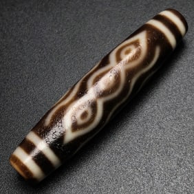A Chinese Carved Agate Wine DZI Bead