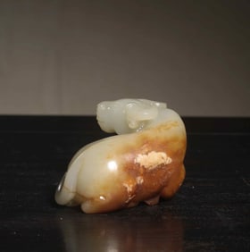 A Chinese Carved Jade Bull Statuette