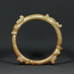 A Chinese Carved Jade Dragon Bangle