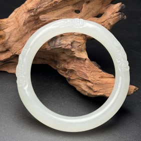 A Chinese Carved Jade Bangle