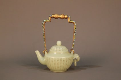 A Chinese Carved Jade Tea Pot with Enamel Glazed Handle