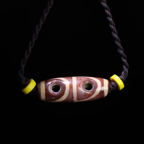 A Chinese Carved Agate Wine DZI Bead