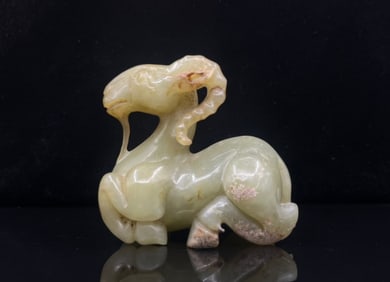 A Chinese Carved Jade Goat Statuette