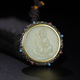 A Chinese Carved Jade Buddha Pendant