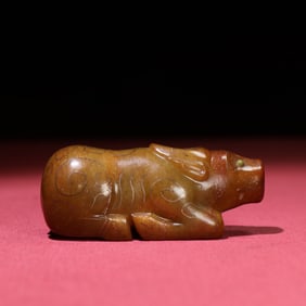 A Chinese Carved Jade Bull Statuette
