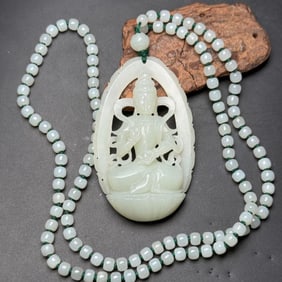 A Chinese Carved Jade Buddha Pendant