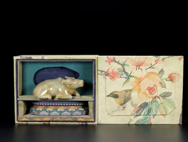 A Chinese Carved Jade Bull Statuette