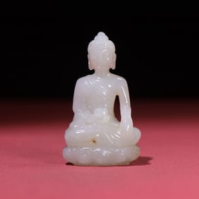 A Chinese Carved Jade Figure of Buddha