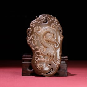 A Chinese Carved Jade Dragon Pendant