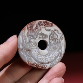 A Chinese Carved Jade Foo-Dog Pendant
