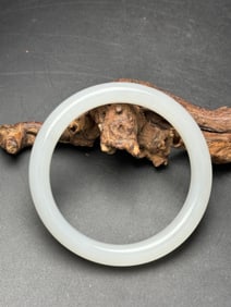 A Chinese Carved Jade Bangle