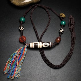 A Chinese Carved Agate Wine DZI Bead