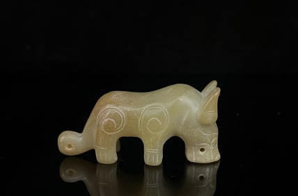 A Chinese Carved Jade Foo-Dog Statuette