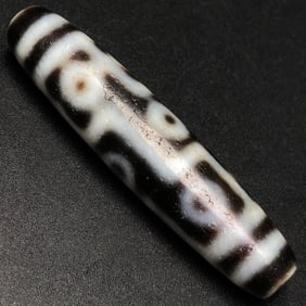 A Chinese Carved Agate Wine DZI Bead